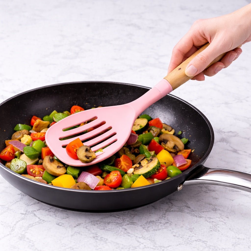 12.6" x 4.3" Ideal Kitchen Silicone w/ Wood Handle Skimmer Pink Slotted Skimmer Utensils lifestyle use image