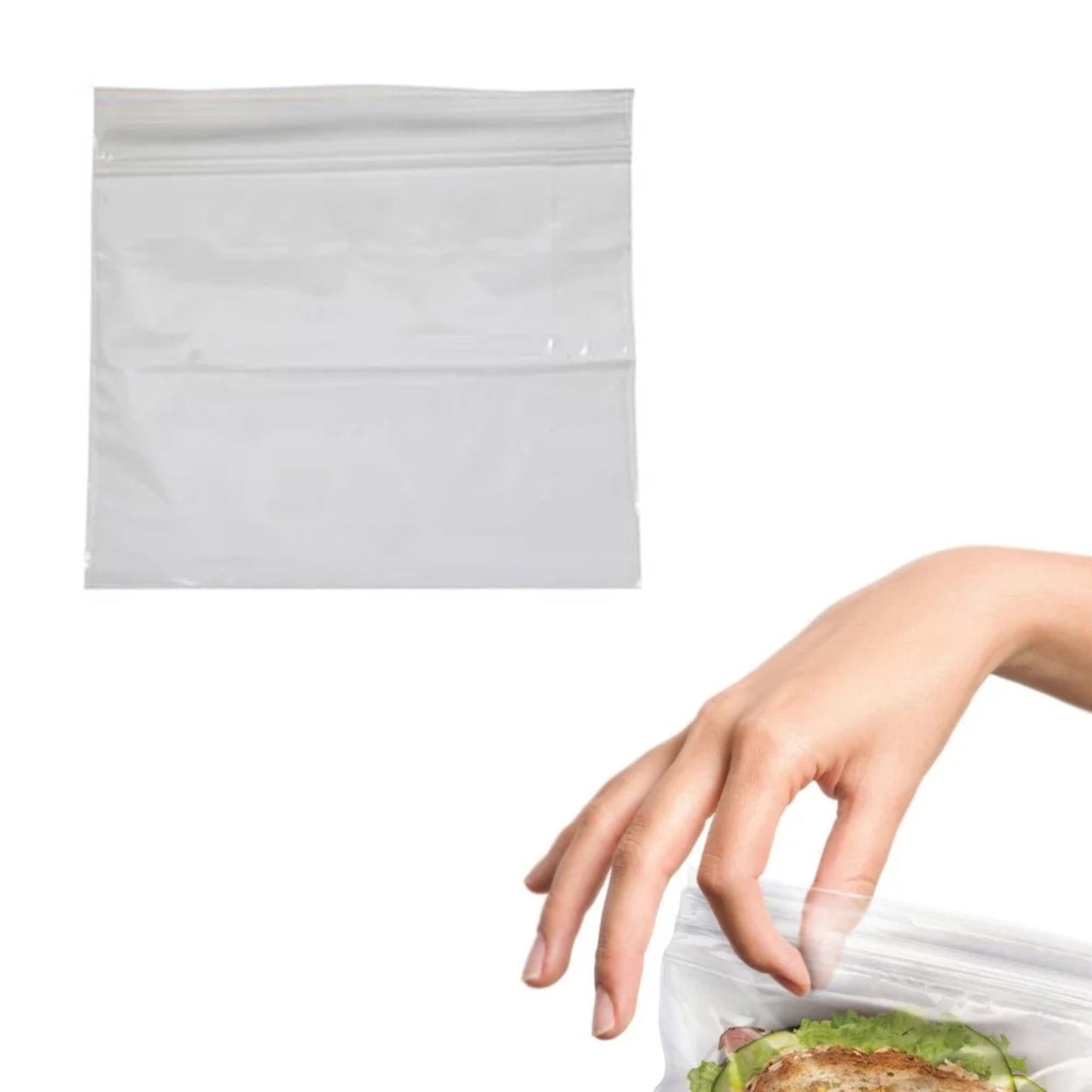 Hand reaching for a clear plastic bag with a sandwich inside on a white background