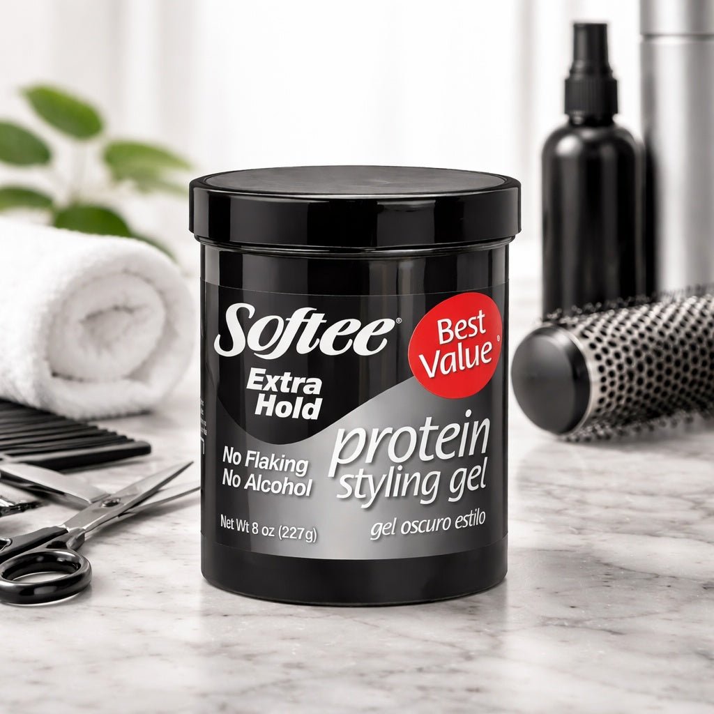 Softee protein styling gel container on a marble surface with hair care items.