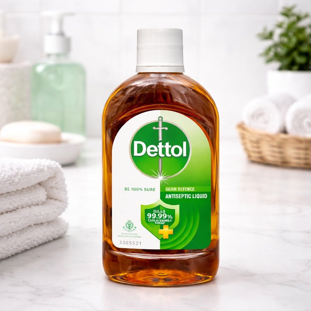 Dettol antiseptic liquid bottle on a bathroom counter with towels and soap in the background