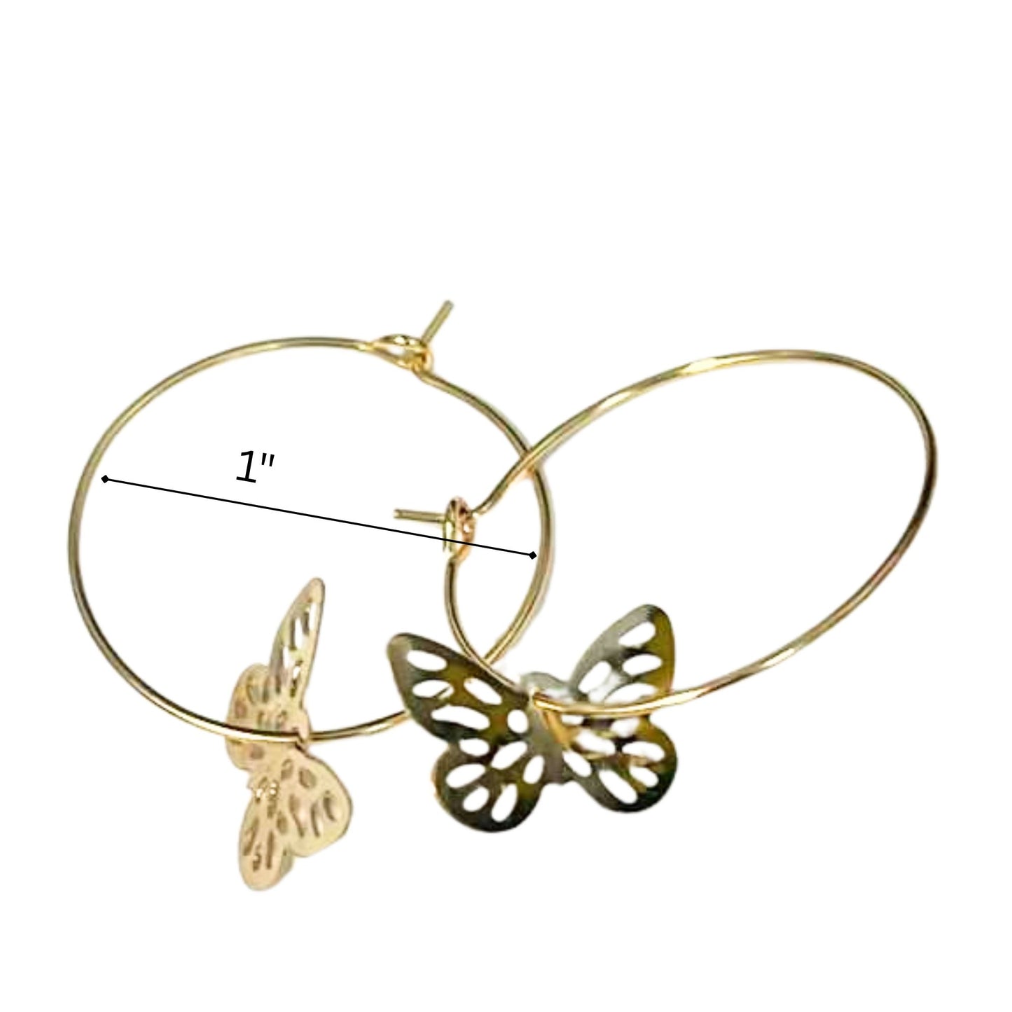 Gold hoop earrings with butterfly designs on a white background