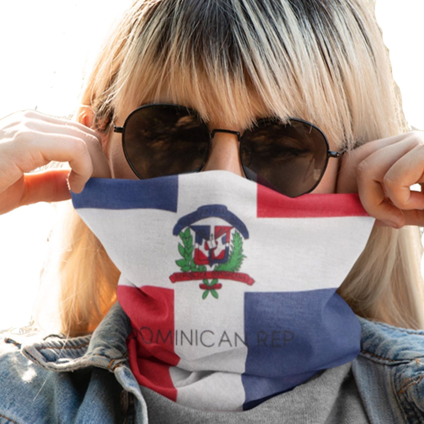 Person wearing a face mask with the Dominican Republic flag design.