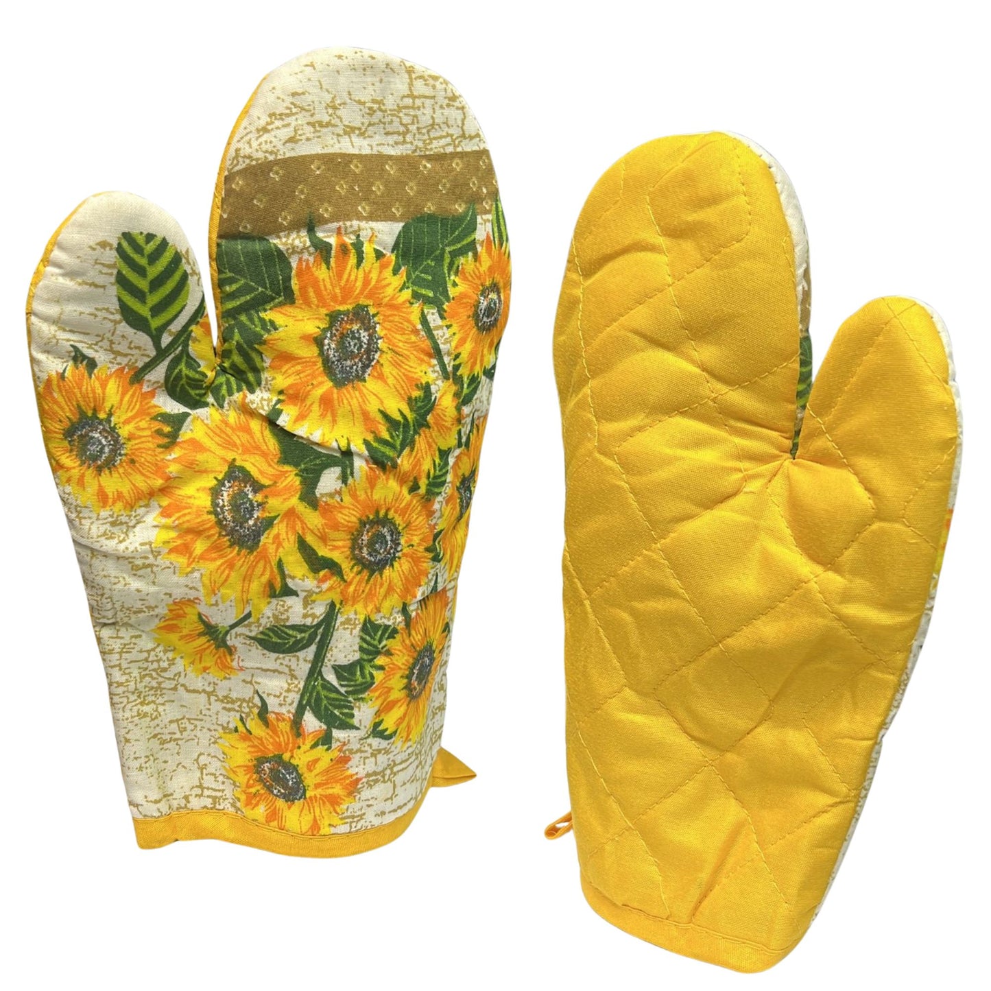 Pair of oven mitts with sunflower design on one and solid yellow on the other.