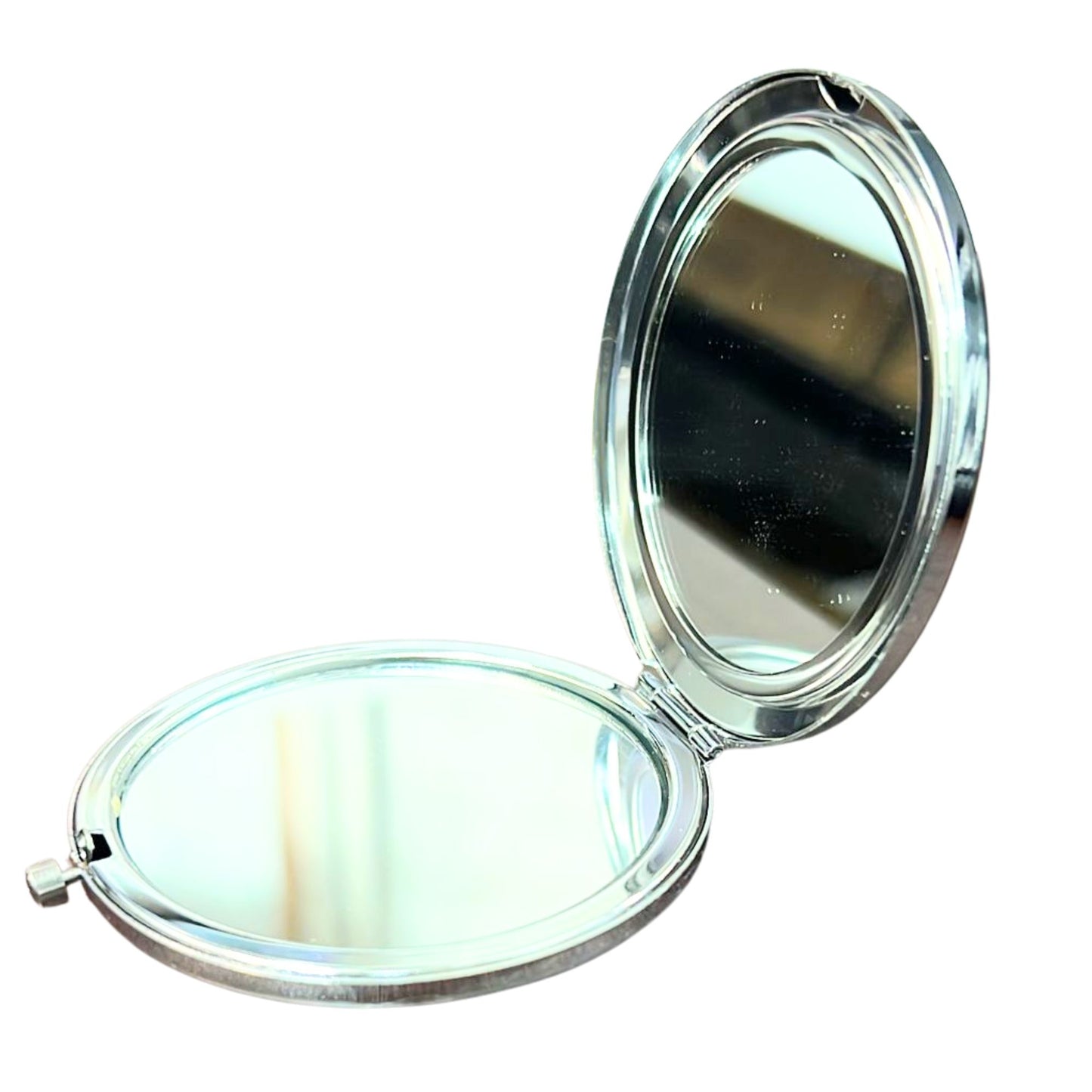 Compact mirror with two reflective surfaces on a white background