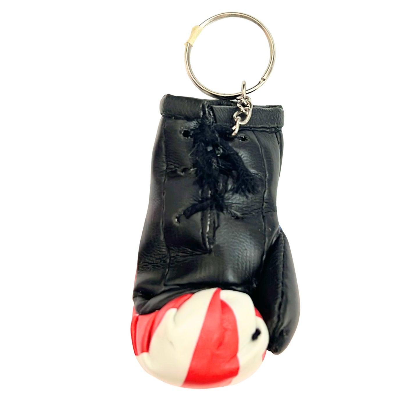 Black leather keychain with a red and white ball on a white background