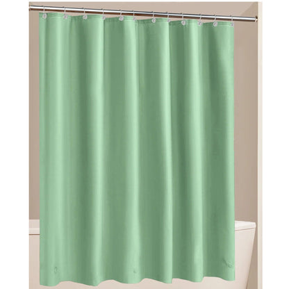 Green shower curtain hanging on a rod against a beige wall.