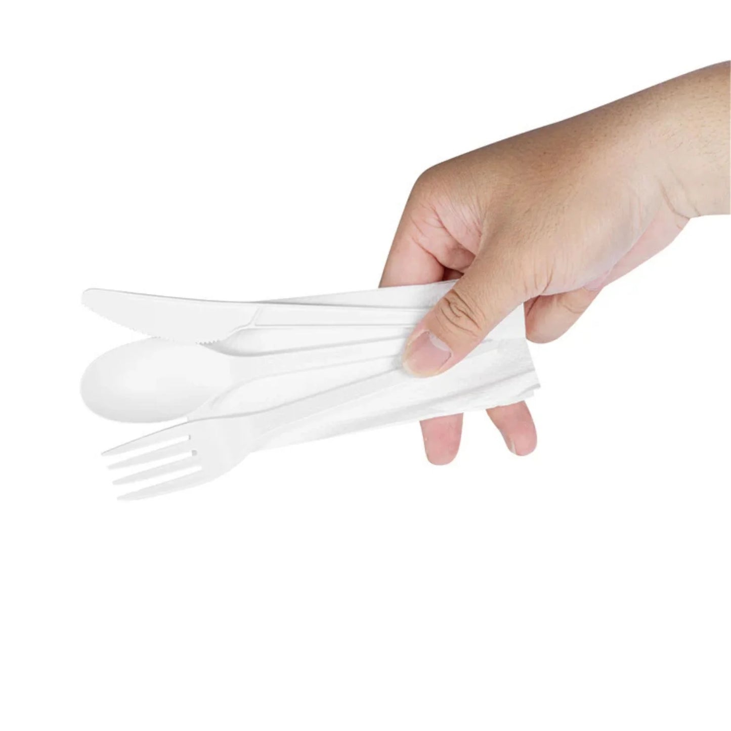 Hand holding a set of white plastic forks against a white background