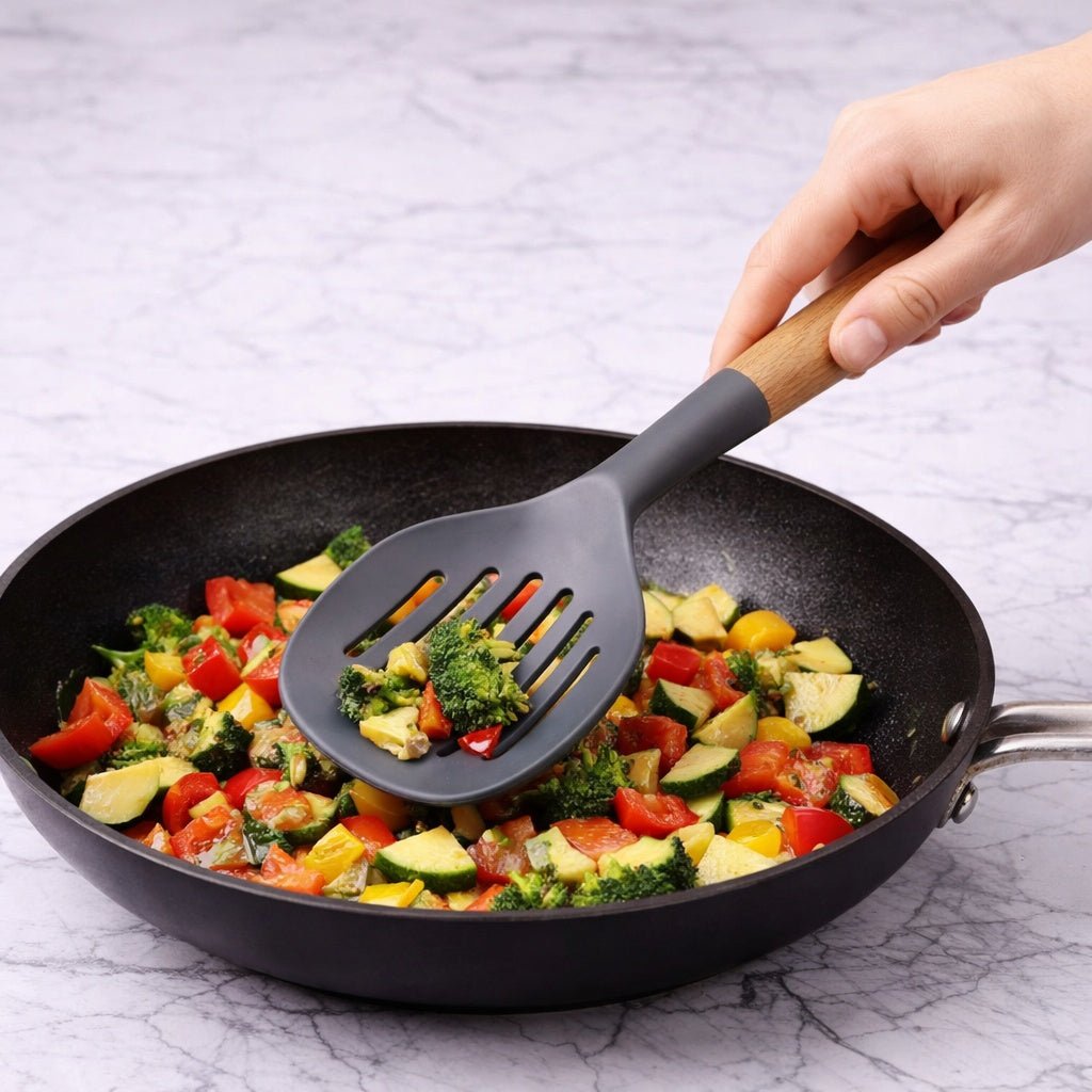 12.6" x 4.3" Ideal Kitchen Silicone w/ Wood Handle Skimmer Gray Slotted Skimmer Utensils lifestyle use image