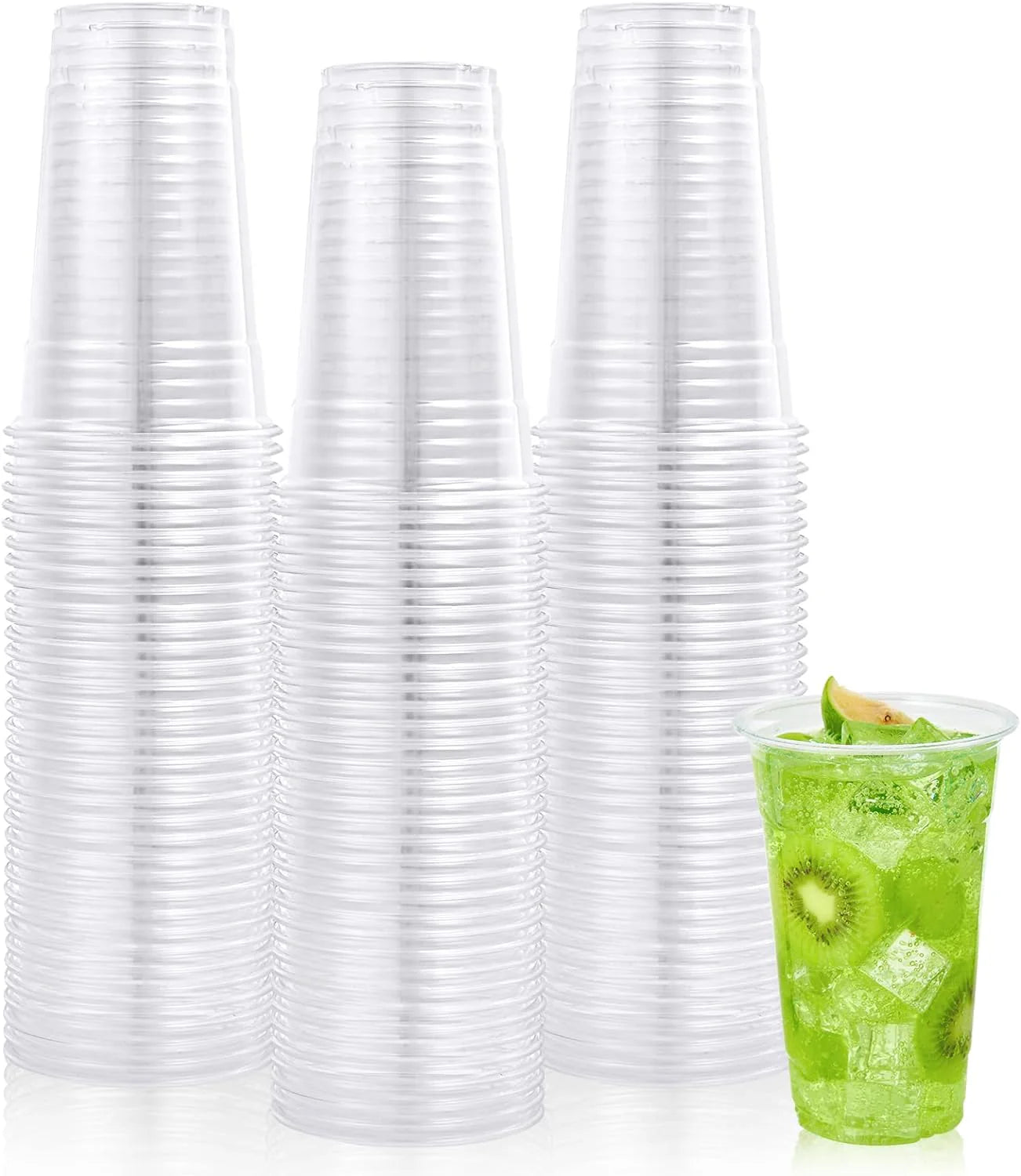 Stacks of clear plastic cups with a green drink in a cup on a white background