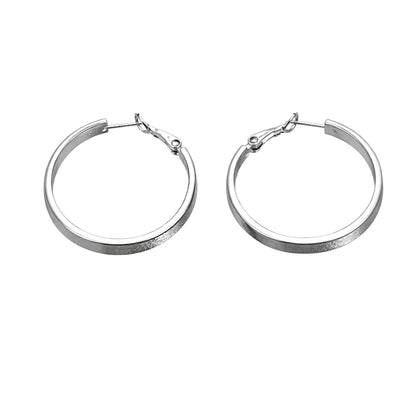 Pair of silver hoop earrings on a white background