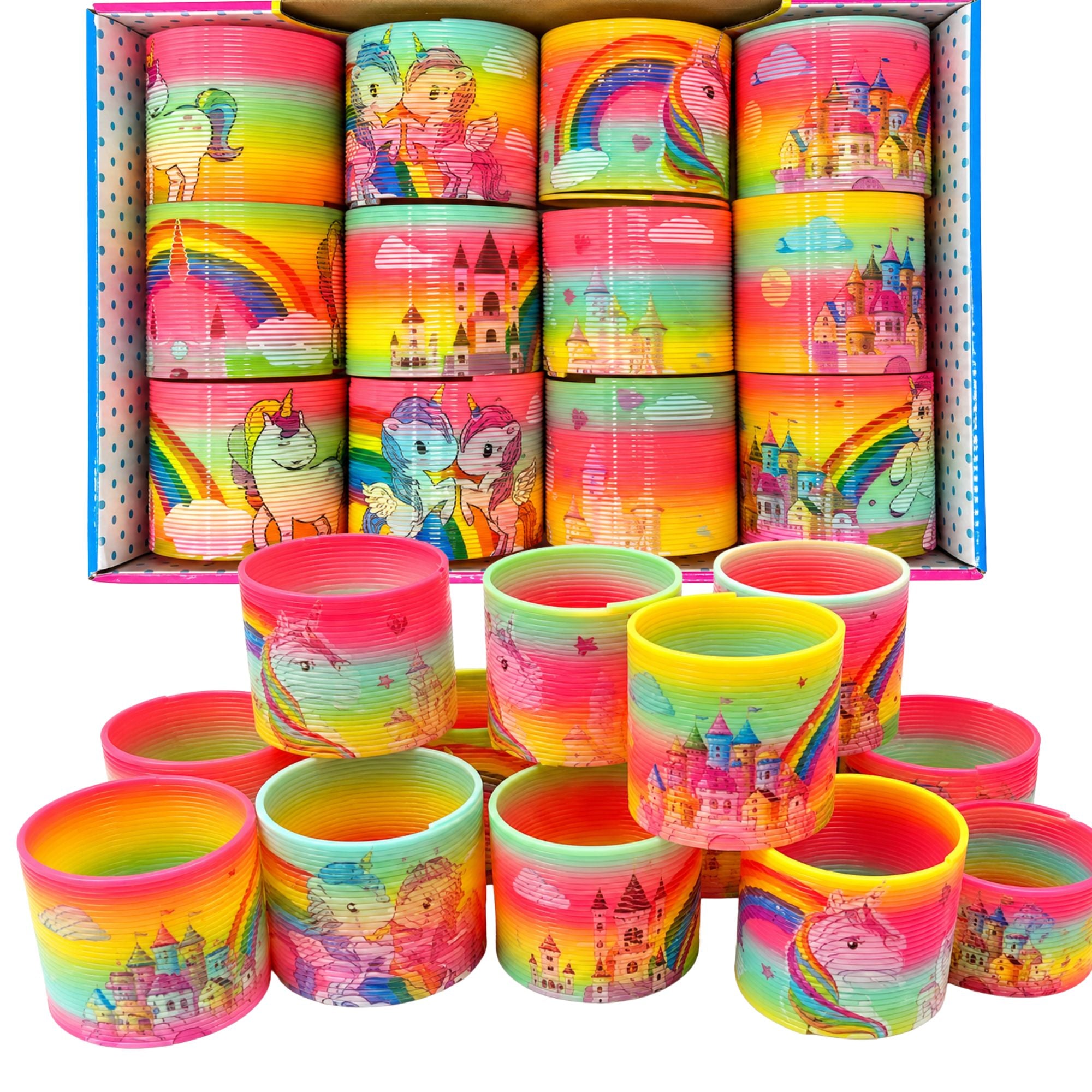 A box of colorful plastic toy slings with matching loose slings arranged in front. The slings feature bright rainbow gradients and whimsical illustrations of unicorns, castles, and rainbows.