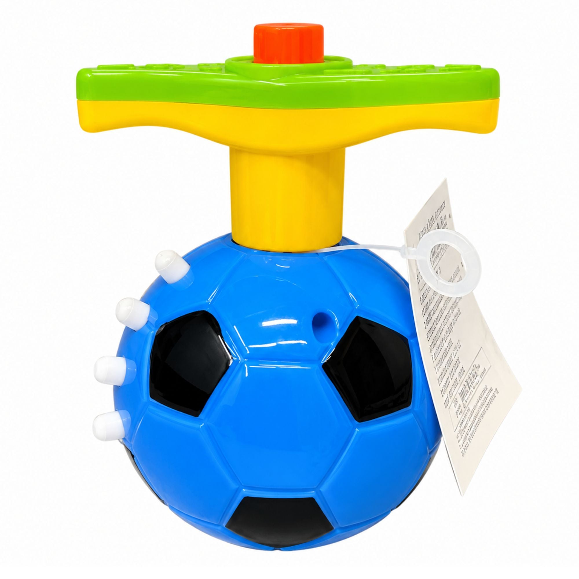 A blue soccer ball-shaped toy with black pentagons, white studs, and a yellow and green handle on top, shown on a white background with a paper tag attached.