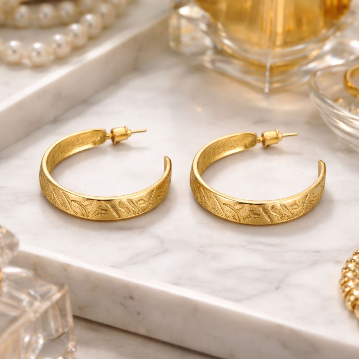 1.25 Inch Gold Tone Engraved Leaf Pattern Hoop Earrings lifestyle use image