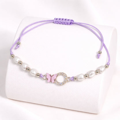 Purple beaded bracelet with a decorative clasp on a white background