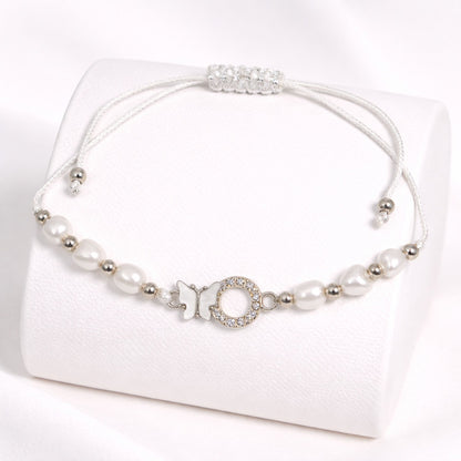Pearl necklace with silver accents on a white background