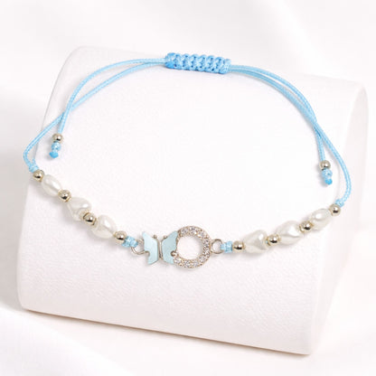 Blue beaded bracelet with a decorative clasp on a white background