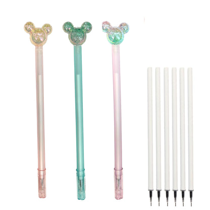 Three decorative pens with interchangeable tips on a white background