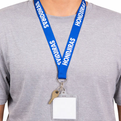 Blue lanyard with 'Honduras' text around a person's neck on a gray background