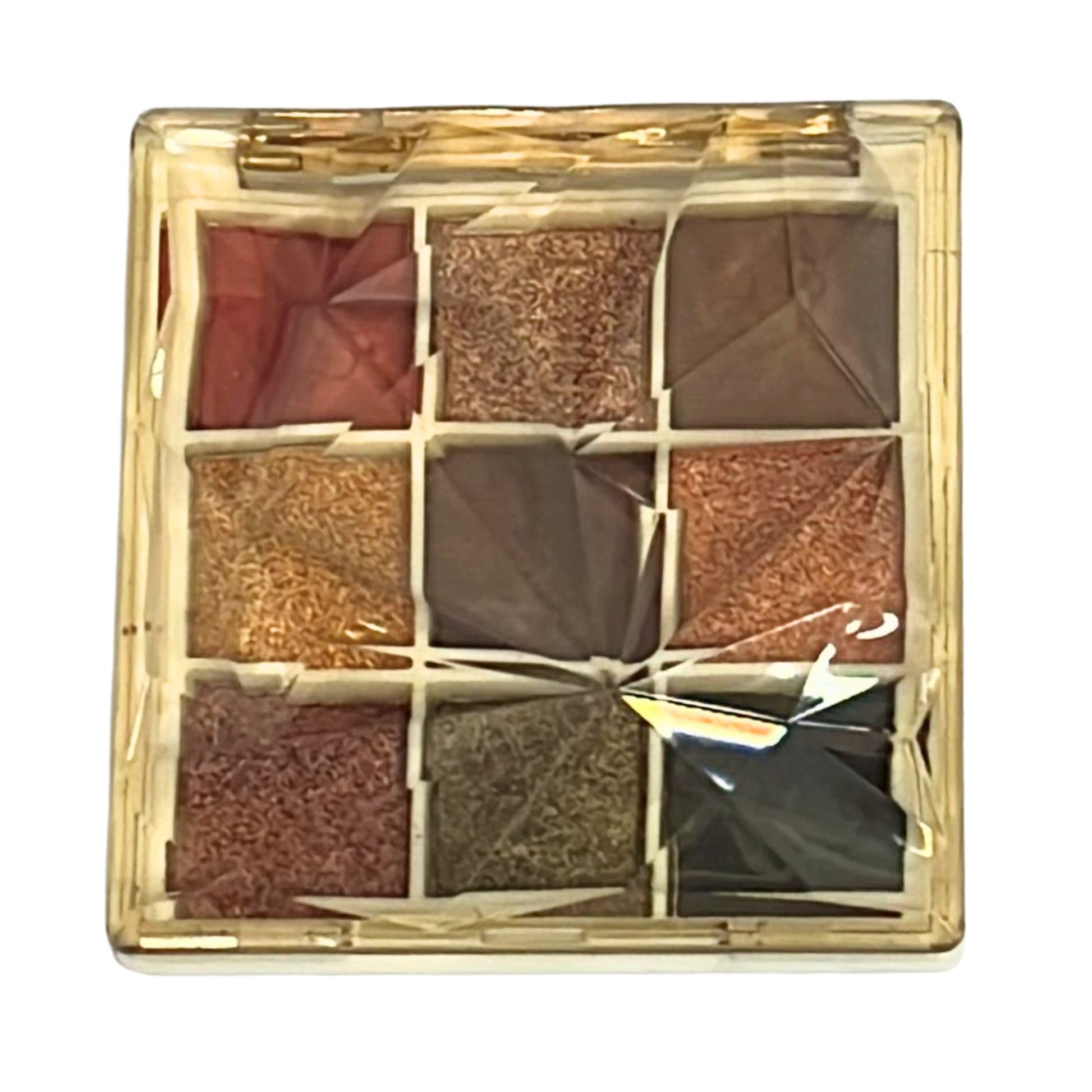Makeup palette with nine square compartments in a gold case
