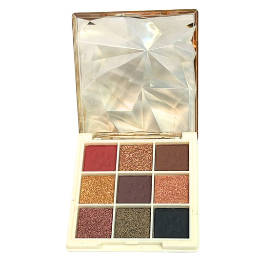 Makeup eyeshadow palette with various colors on a white background