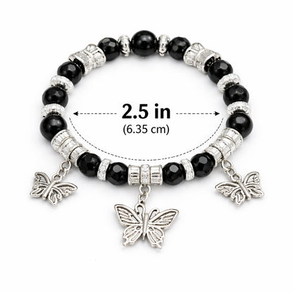Black beaded bracelet with butterfly charms and size measurement on a white background