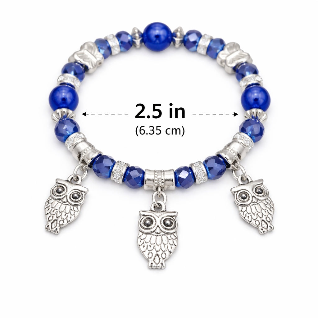 Blue beaded bracelet with owl charms and measurement label on a white background