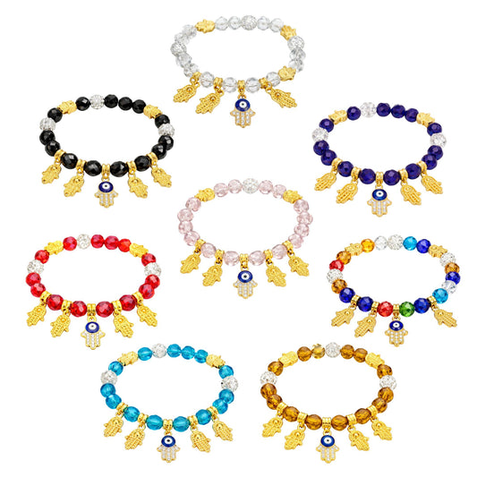 Set of colorful beaded bracelets with evil eye charms on a white background