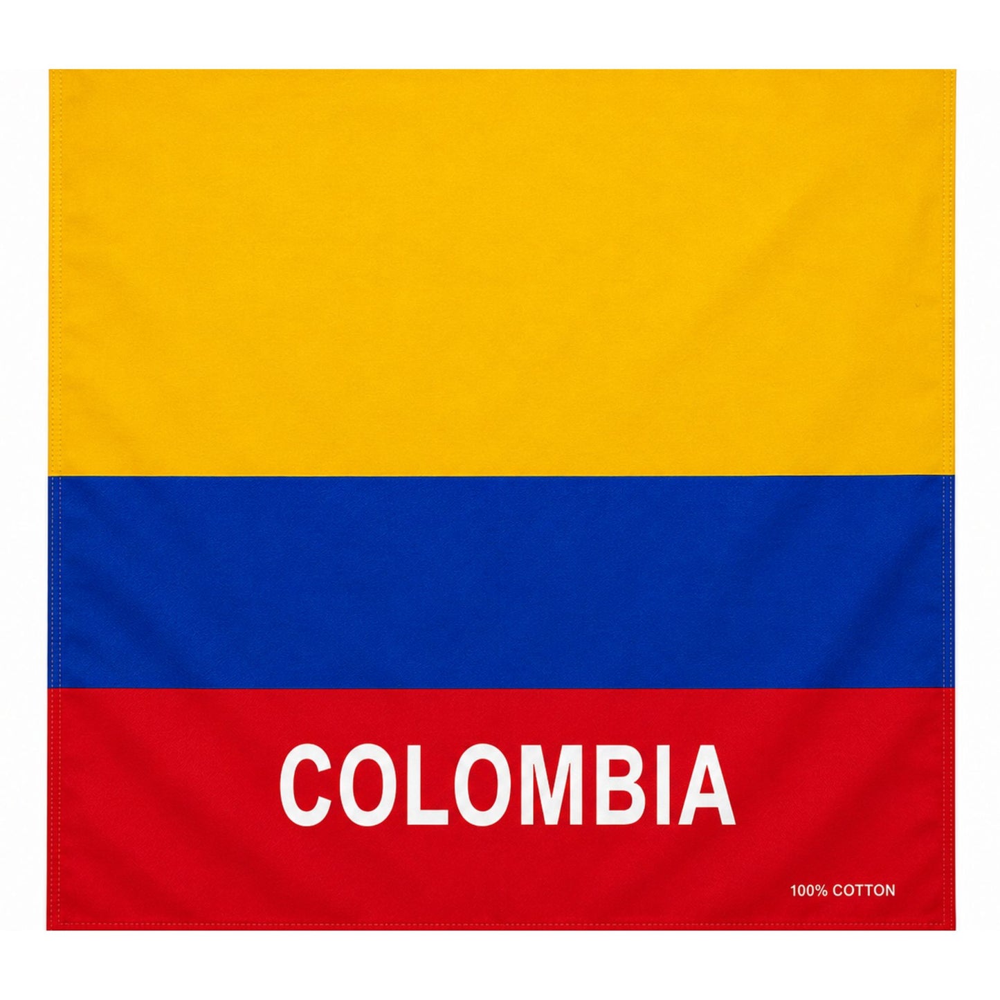 A square cotton flag or towel featuring the horizontal yellow, blue, and red stripes of the Colombian flag, with the word "COLOMBIA" printed in large white letters across the red band and a small "100% COTTON" label in the lower right corner.