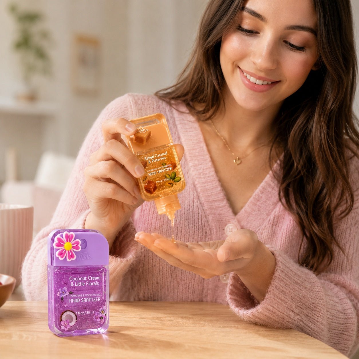 Woman applying hand sanitizer to her palm with a product in the foreground
