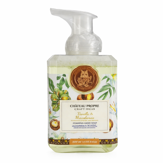 Foaming hand soap bottle with decorative label on a white background