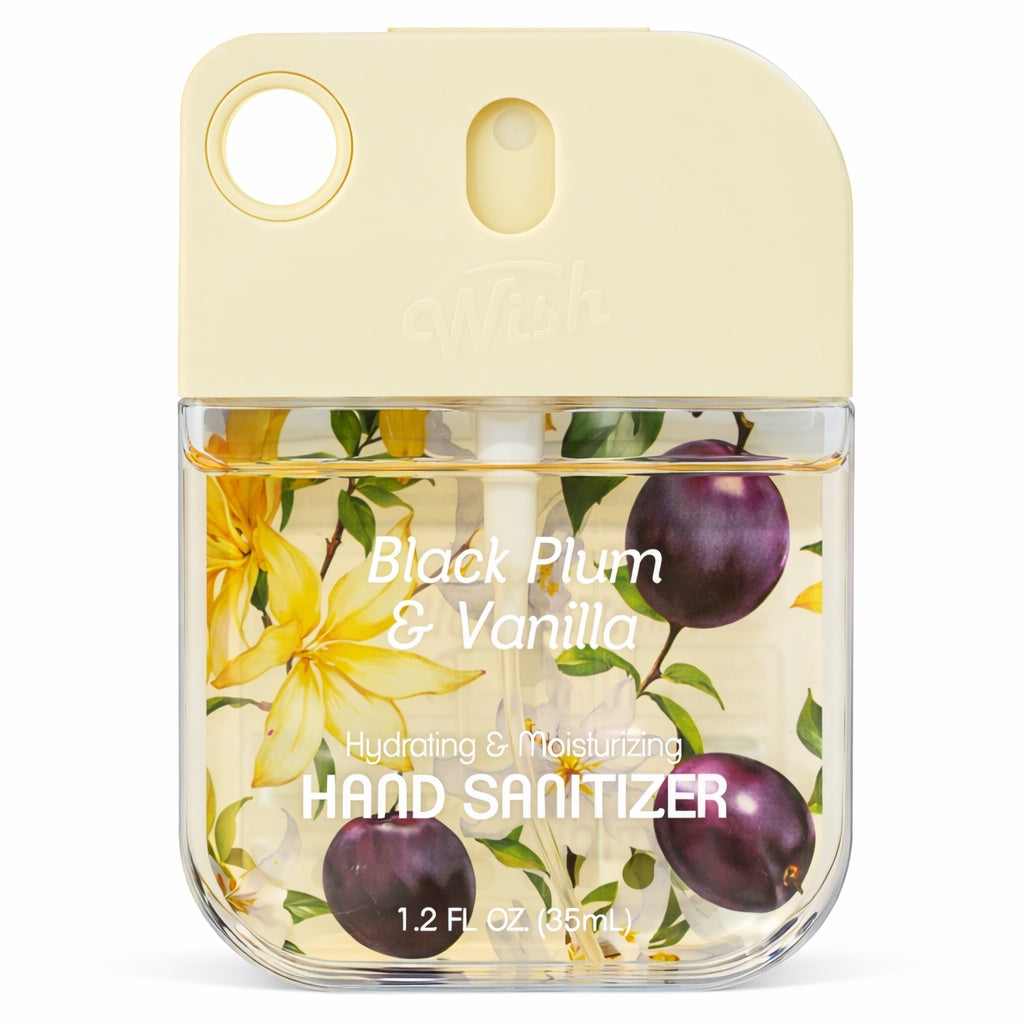 Hand sanitizer bottle labeled 'Black Plum & Vanilla' with floral design on a white background