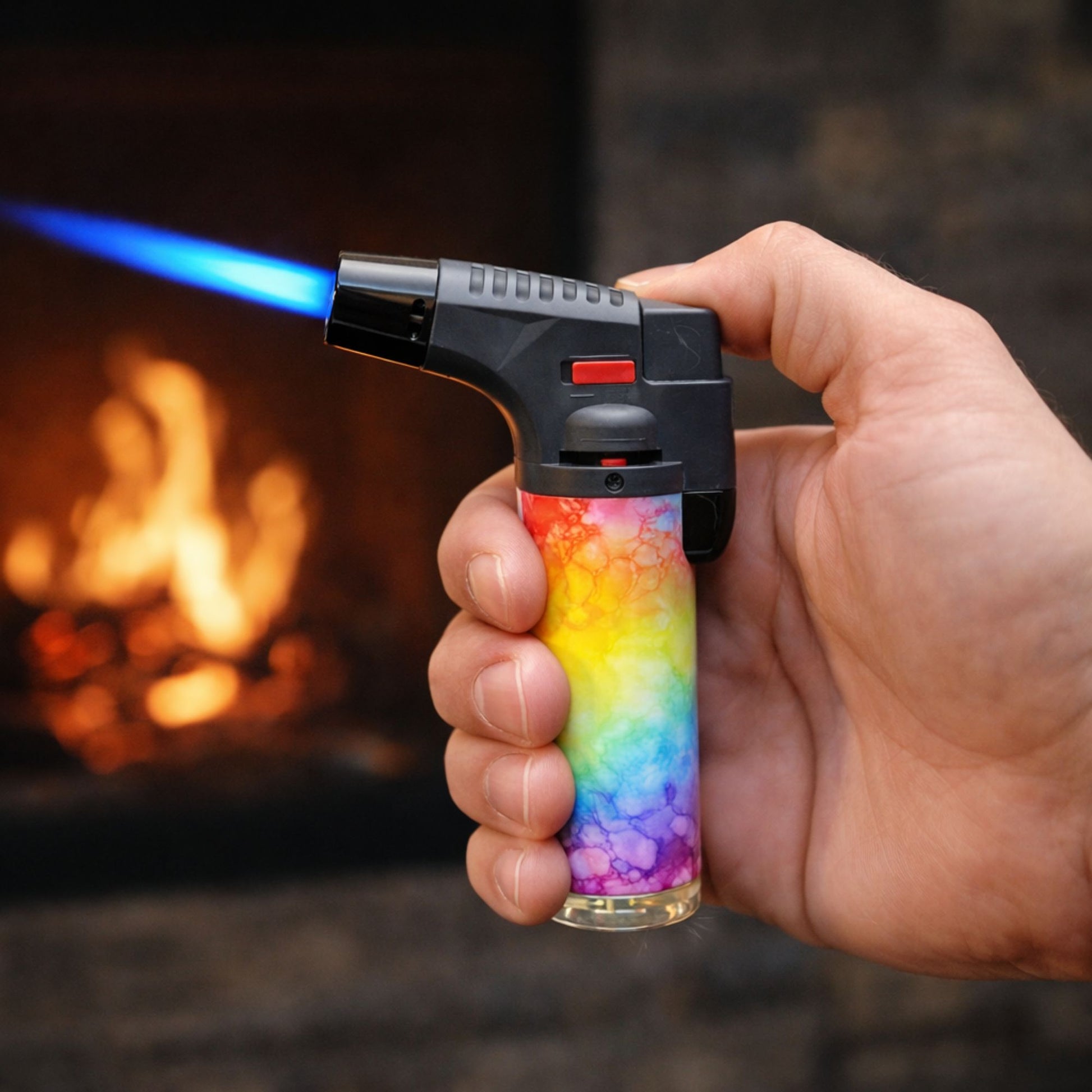 Using Blink 4.5-inch tie dye torch lighter with blue jet flame in front of a fireplace.