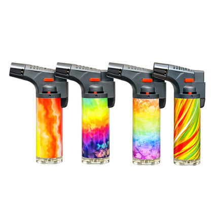 Blink 4.5-inch tie dye torch lighter with blue jet flame in front of a fireplace.