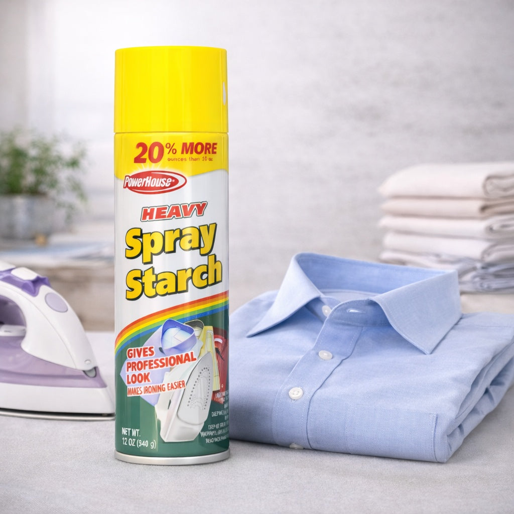 Can of Powerhouse spray starch next to a folded blue shirt and iron on a light background