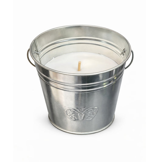 Silver metal bucket with a candle inside on a white background