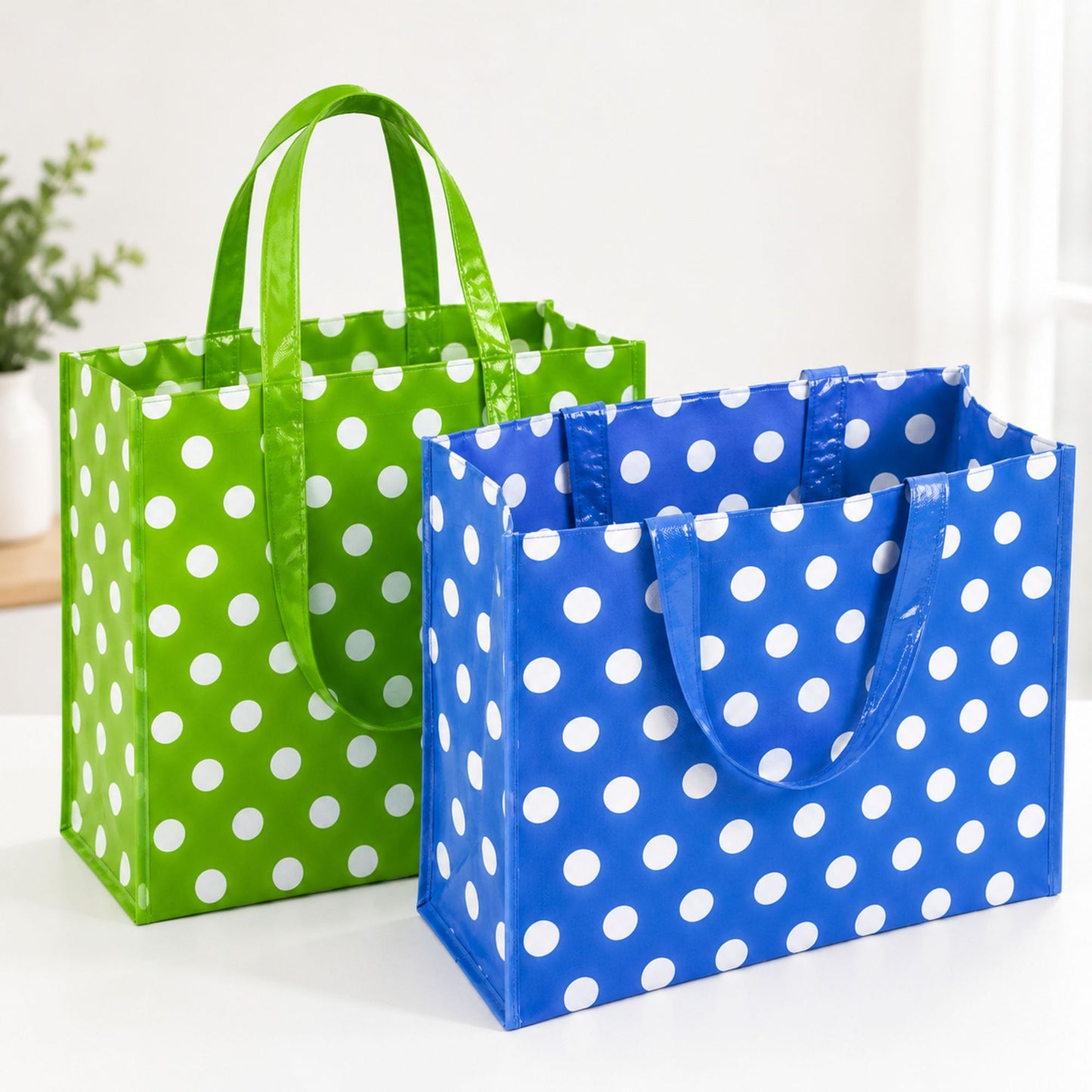 Large reusable green and blue polka dot shopping tote bags with sturdy handles and spacious eco-friendly design