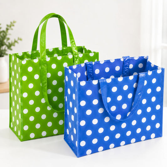 Large reusable green and blue polka dot shopping tote bags with sturdy handles and spacious eco-friendly design
