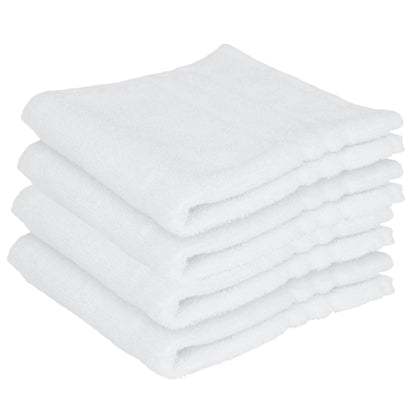 Stack of white folded towels on a white background