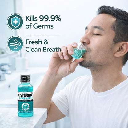 Person using Listerine mouthwash with product packaging displayed.