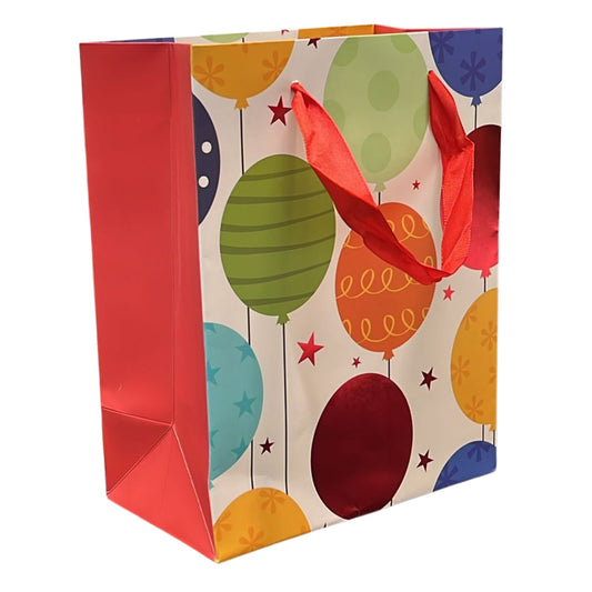 Colorful gift bag with balloon design on a white background