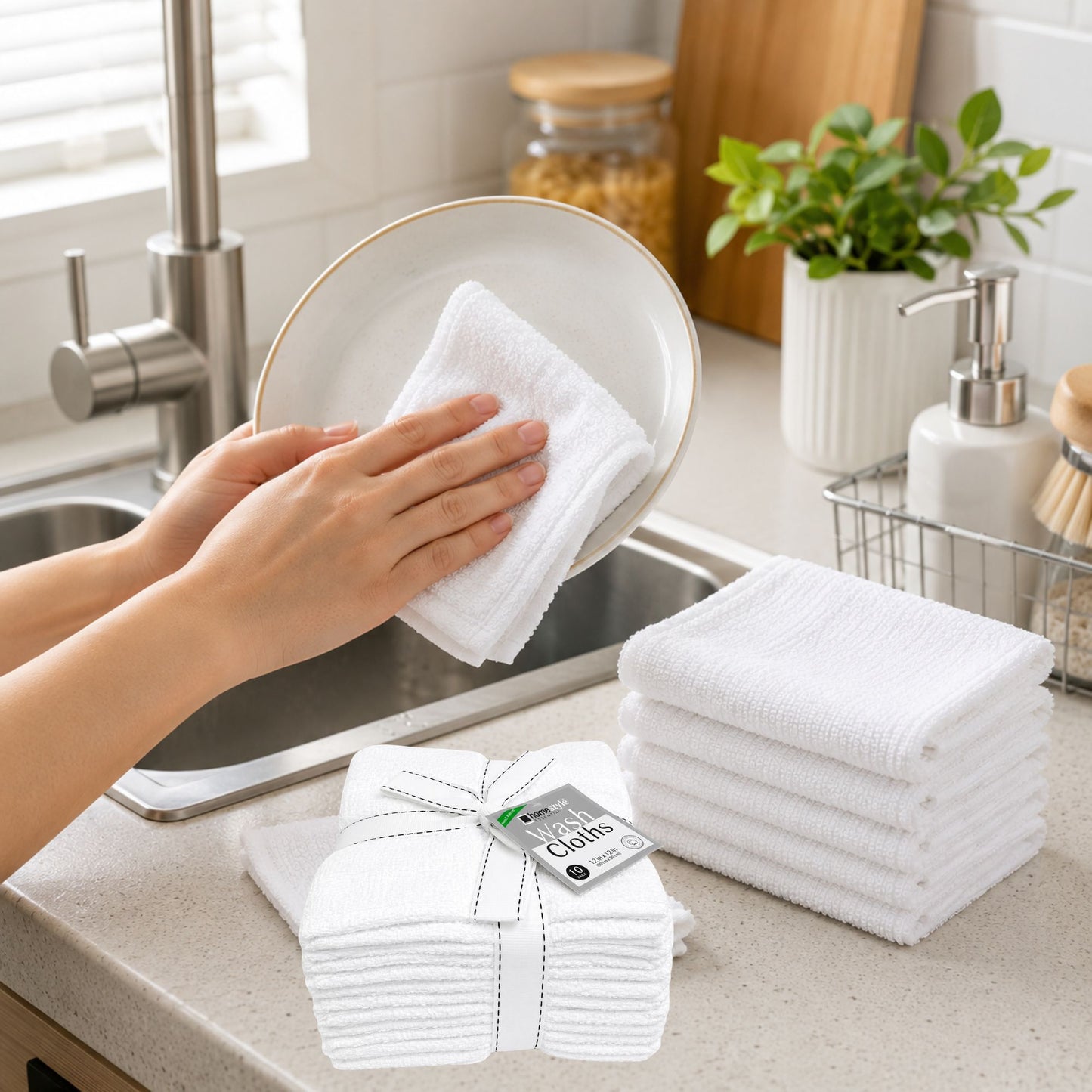Person cleaning a plate with a white towel in a kitchen, with folded towels and a box of towels on the counter.