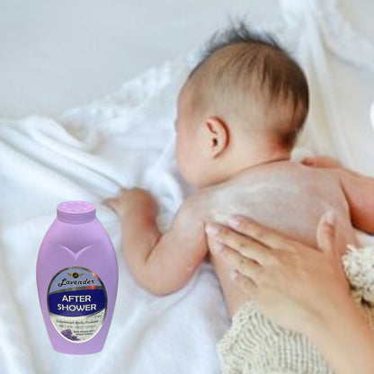 Baby being held with a bottle of 'After Shower' lavender product in the foreground.