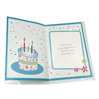 Open birthday card with a cake illustration and colorful text on a white background