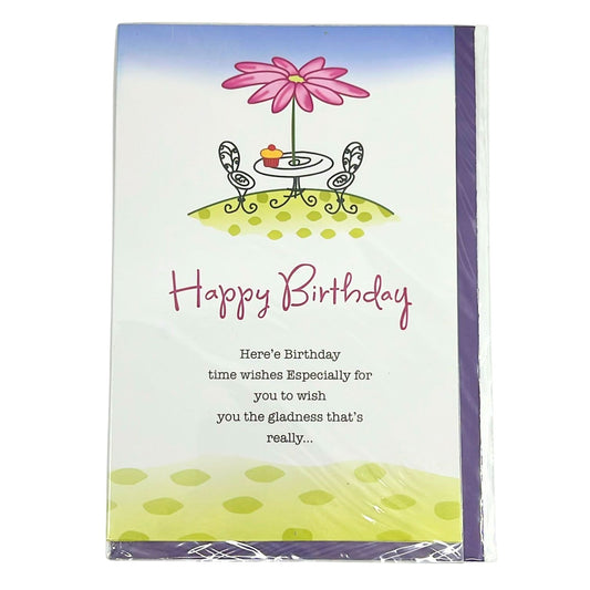 Birthday card with a pink flower, table, and chairs on a white background