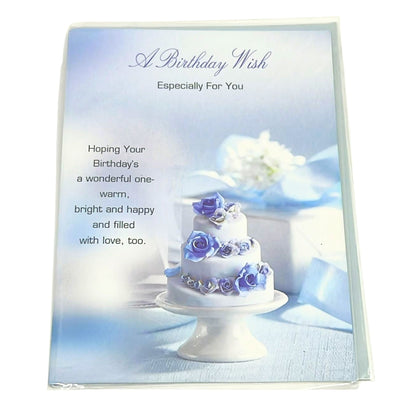 Birthday card with a cake and flowers on a blue background