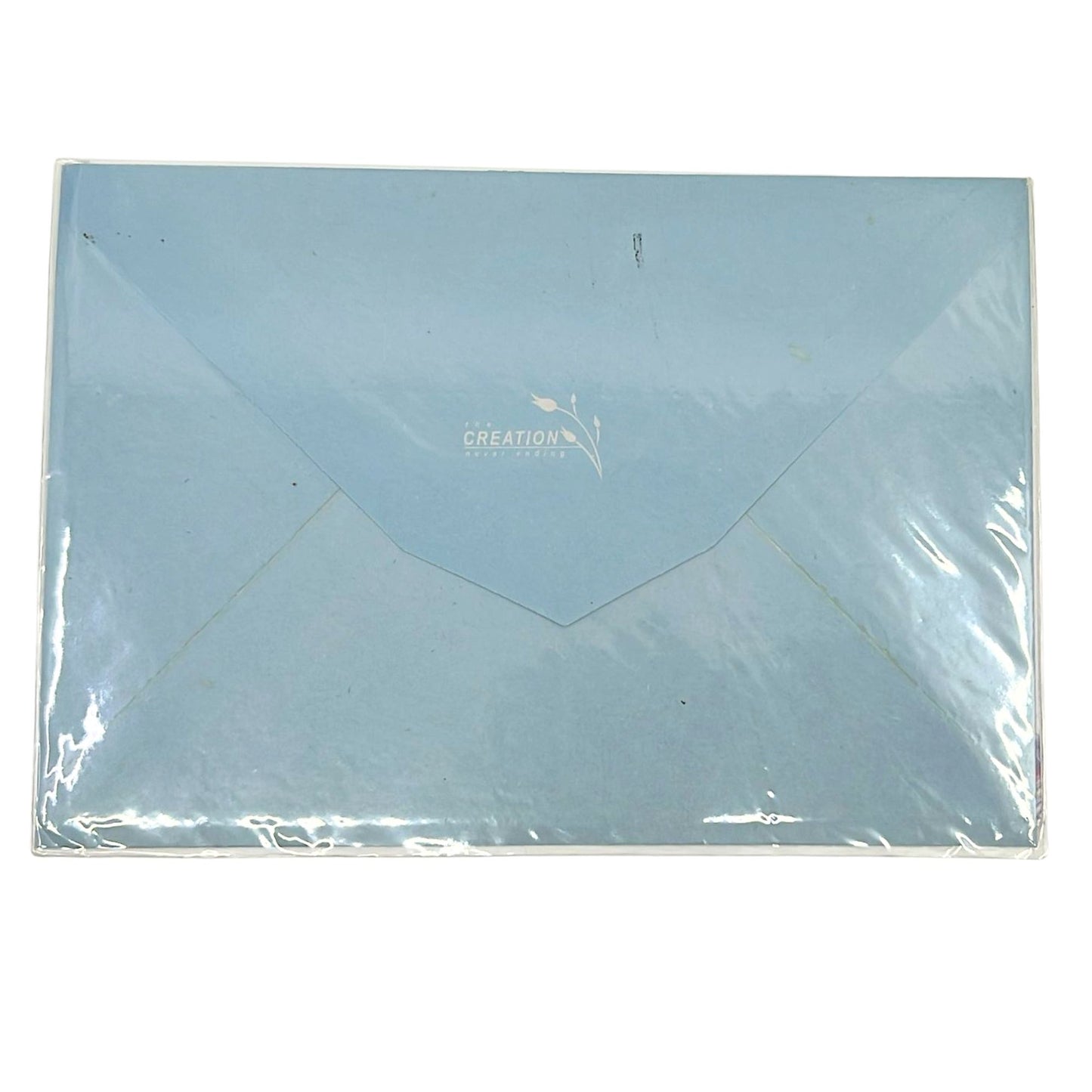 Light blue envelope with 'Creation' branding on a white background