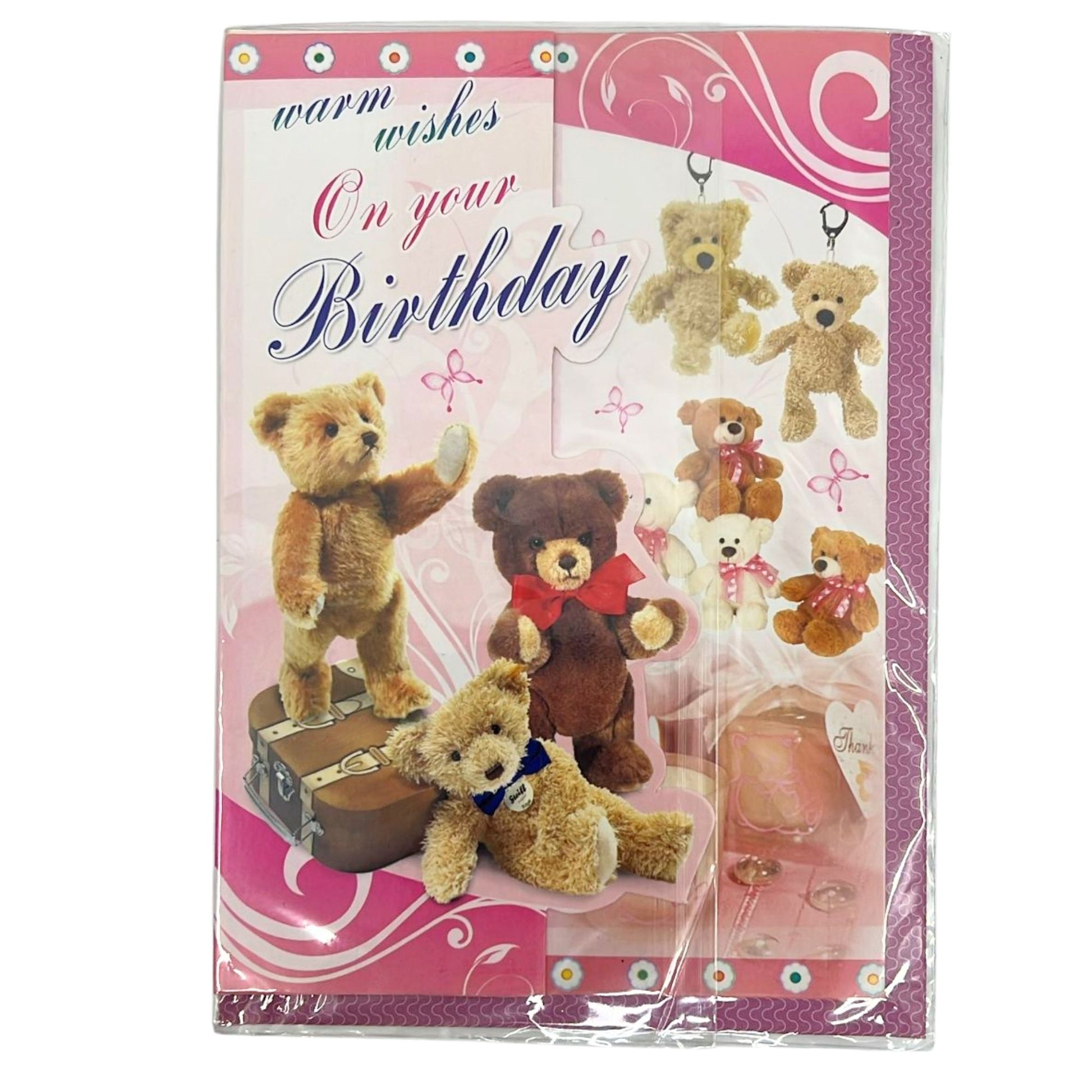 Packaged birthday card with teddy bears and 'warm wishes on your birthday' text.