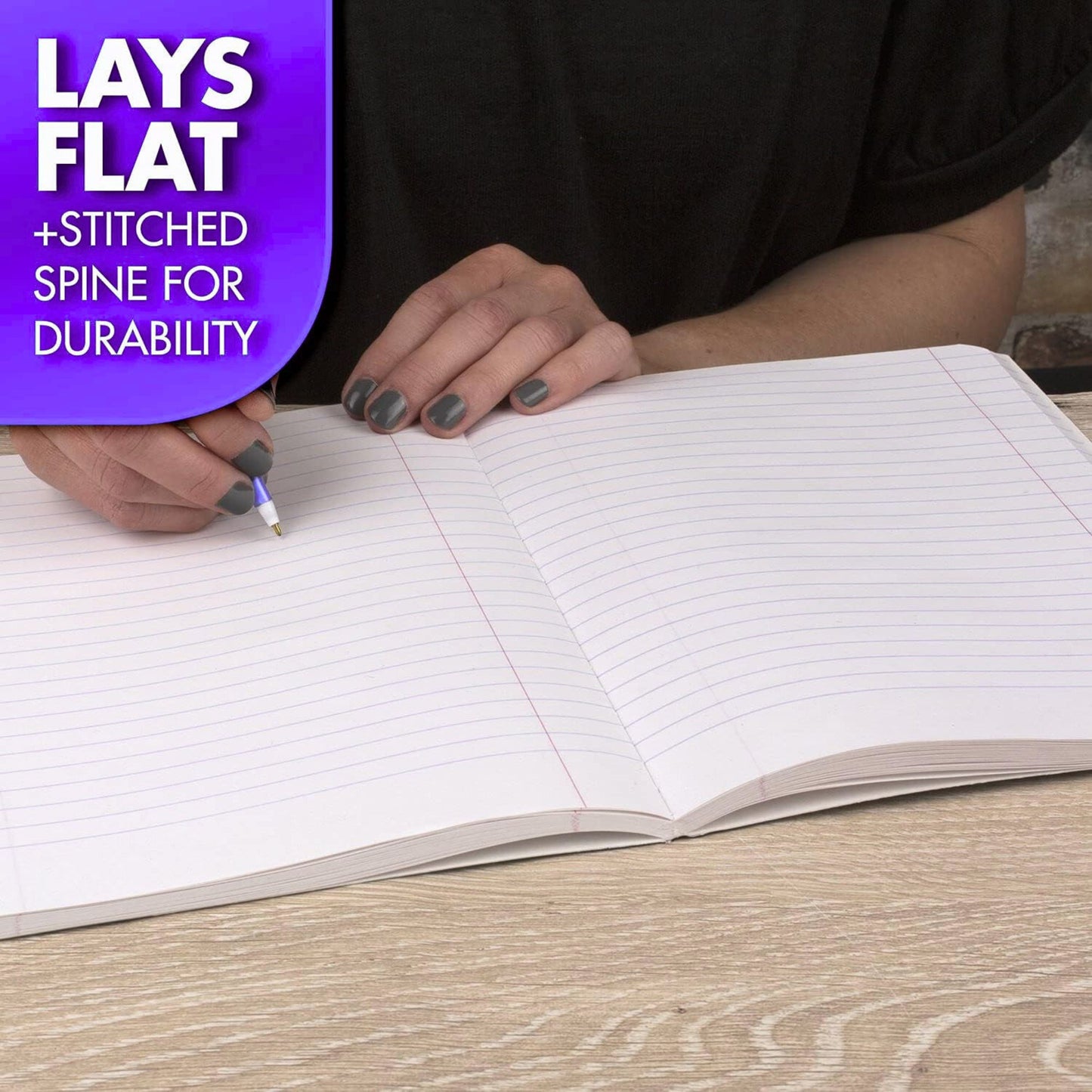 Person writing in an open notebook with text about durability on a purple label.