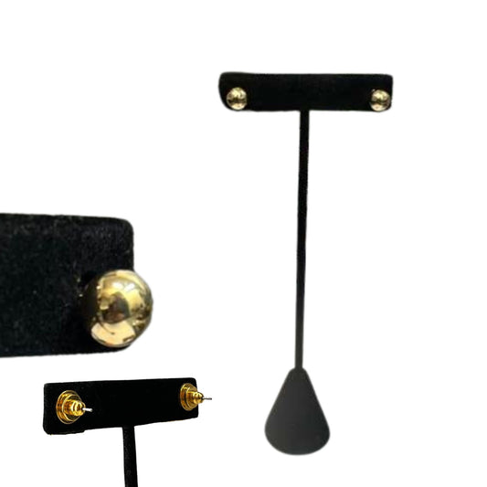 Gold earring on a black earring stand against a white background
