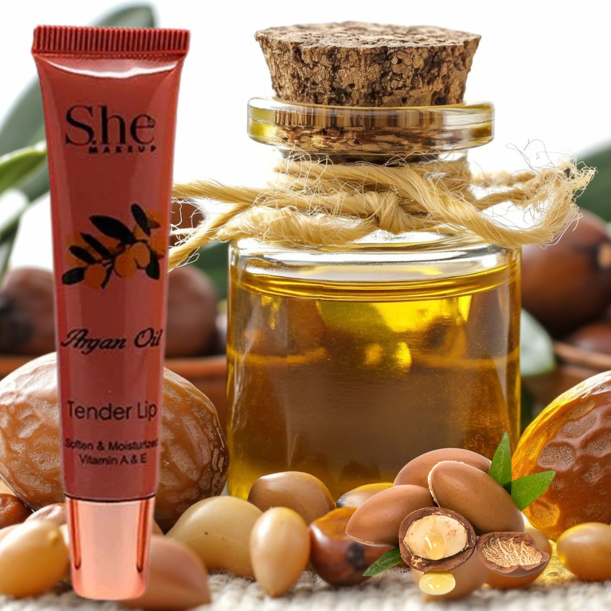 She Mango Argan Oil product with argan nuts and oil bottle on a natural background